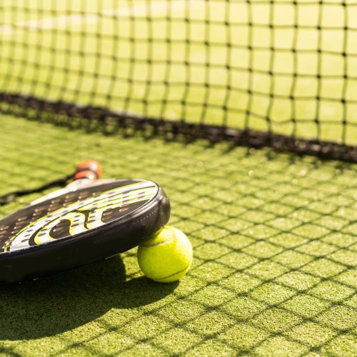 padel tennis racket sport court and balls.